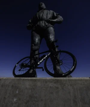 Road Bike Leaning Against a Giant Statue