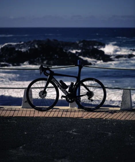 Road Bike Parked on a Railing Overlooking the Ocean