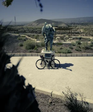 Road Bike Leaning Against a Statue