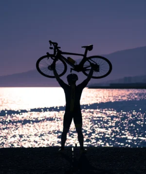 Person Holding a Road Bike over the Head