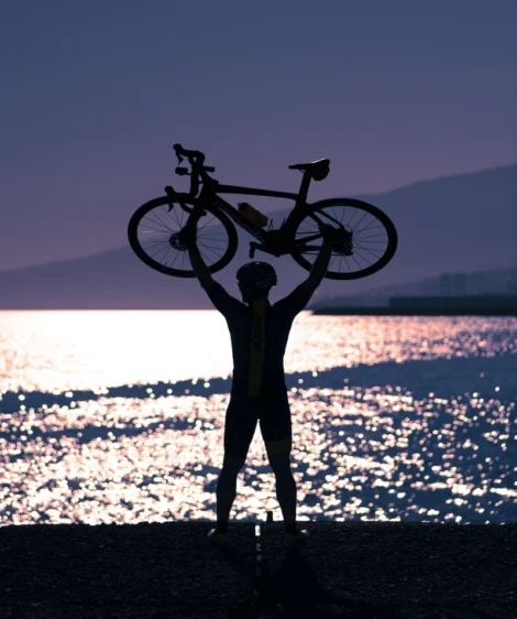 Person Holding a Road Bike over the Head
