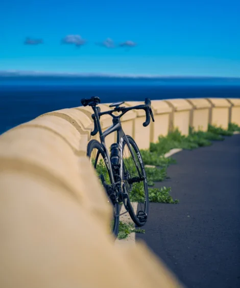 Road Bike Parked on a Road by the Ocean