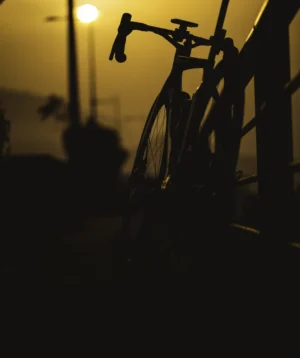 Road Bike Parked on a Street at Sunset