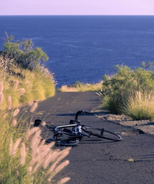 Road Bike Lying on the Ground by the Ocean