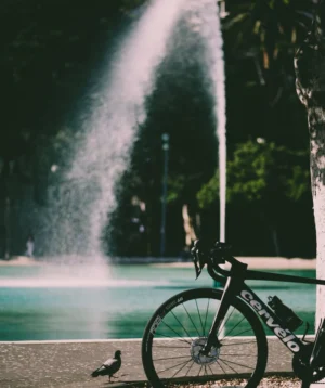Road Bike Parked Next to a Fountain