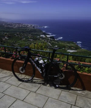 Road Bike Parked in a Viewpoint Overlooking a City and the Ocean