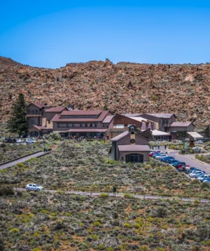 Large Building With Parking Lot in Front of It