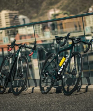 Group of Bikes Parked on Sidewalk