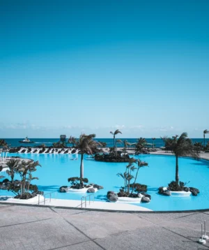 Pool With Trees and Buildings Around It