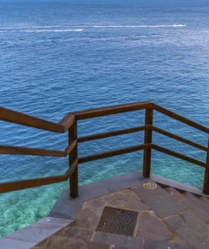 Wooden Railing Over Body of Water