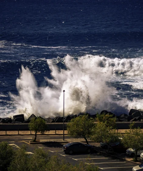 Large Wave Crashing Into Parking Lot