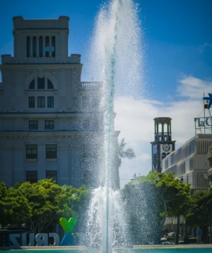 Large Building With Fountain in Front of It