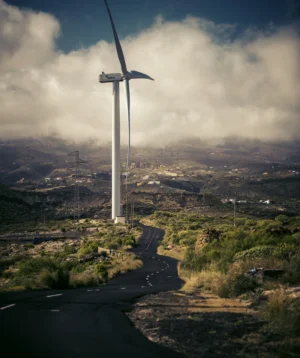 Road With Windmills on the Side With Milad Tower in the Background