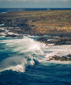 Large Wave Crashing Into Rocky Shore