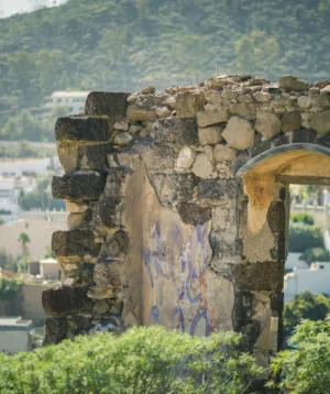 Stone Archway With City in the Background