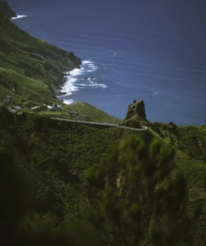 Green Mountain With Body of Water in the Background