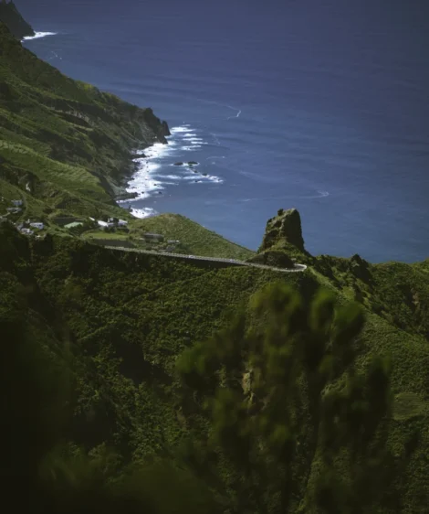 Green Mountain With Body of Water in the Background
