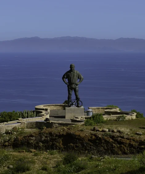 Statue of Man on Rock by the Water