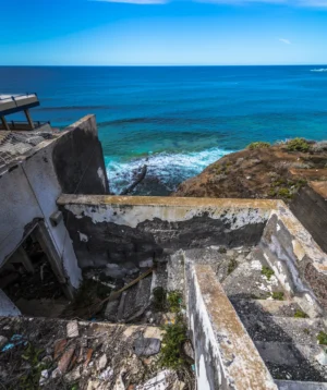 Cliff Side With Body of Water in the Background