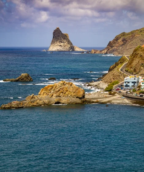Body of Water With Rocky Island in the Distance With Roques De Anagin the Background