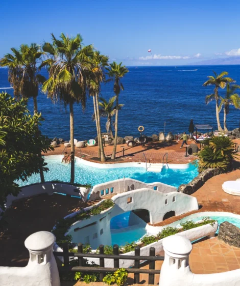 Pool With Beach and Palm Trees