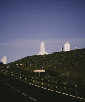 Road Leading to Large White Tower on Hill