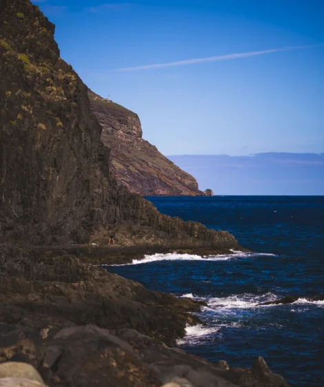 Rocky Cliff Next to Body of Water