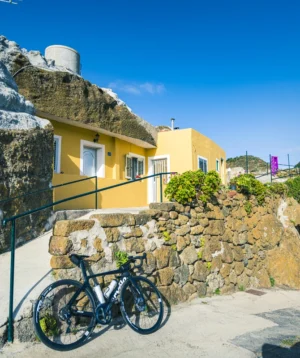 Bicycle Parked on Stone Wall