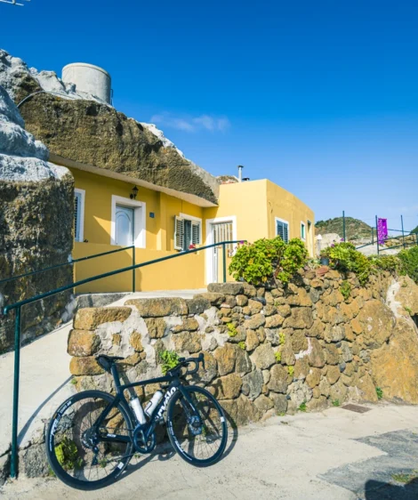 Bicycle Parked on Stone Wall