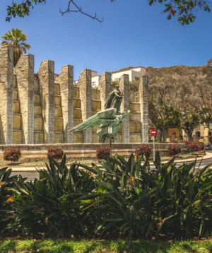 Stone Building With Garden in Front of It