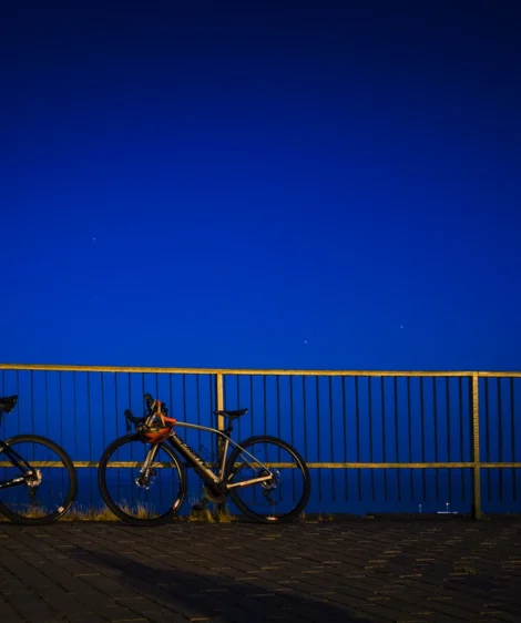 Group of Bikes Parked on Bridge