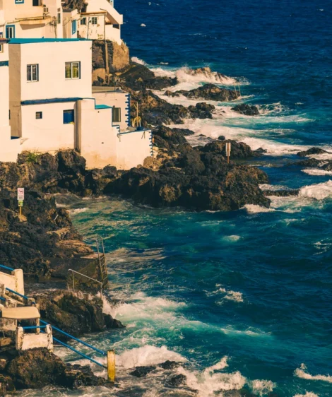 Building on Cliff Above the Ocean