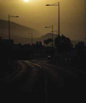Road With Cars on It and Sunset in the Background
