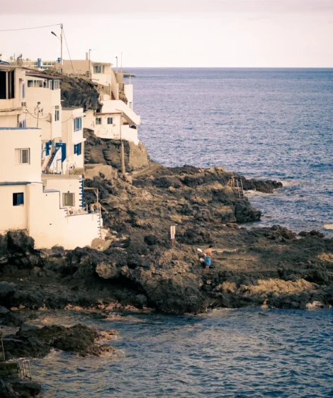 Rocky Cliff With Buildings on It