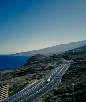 Highway With Cars on It Next to Body of Water