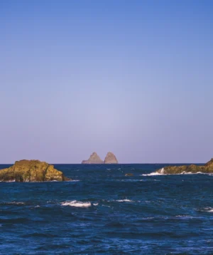 Body of Water With Large Rocks in It