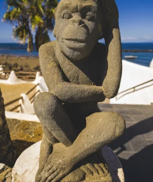 Statue of Person With Beard and Mustache on Beach