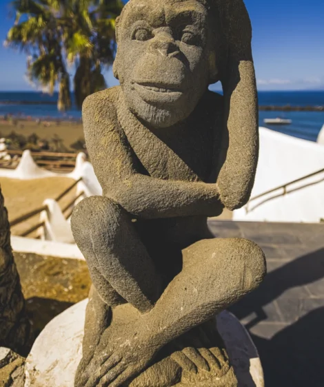 Statue of Person With Beard and Mustache on Beach