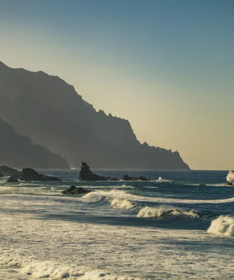 Beach With Waves Crashing Against the Rocks