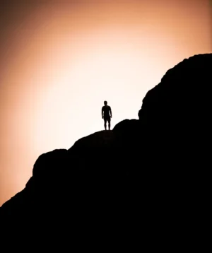 Person Standing on Rock