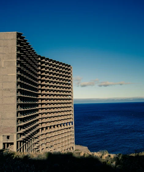 Tall Building Next to Body of Water