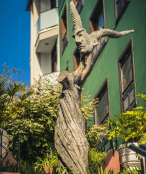 Tree With Statue of Deer on It